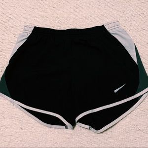 Black woman’s Nike running shorts